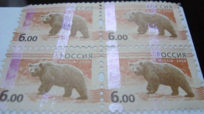 Квартблок марок наклеен на чистый не прошедший почту конверт одной из организаций